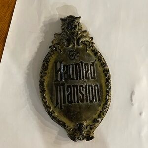 Resin haunted mansion wall hanging